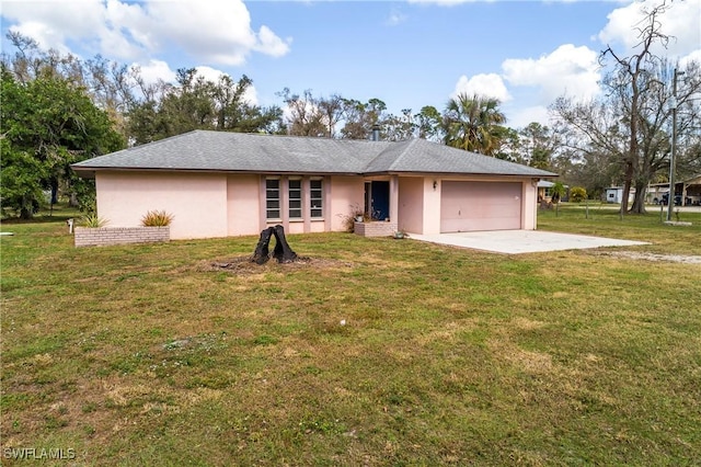 ranch-style home featuring a garage and a front lawn