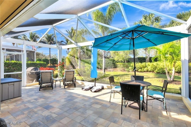 view of patio / terrace featuring a lanai