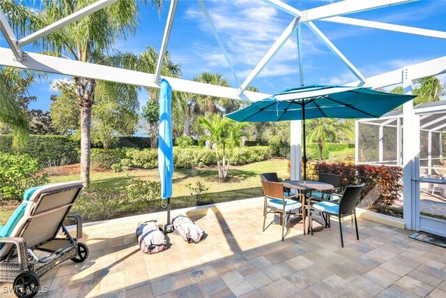 view of patio / terrace with a lanai