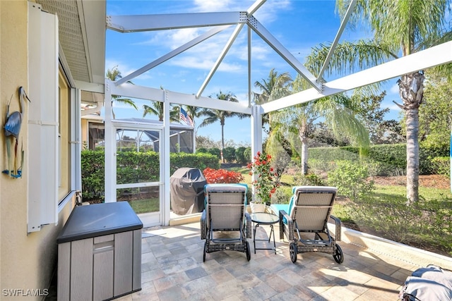 view of patio / terrace with a lanai