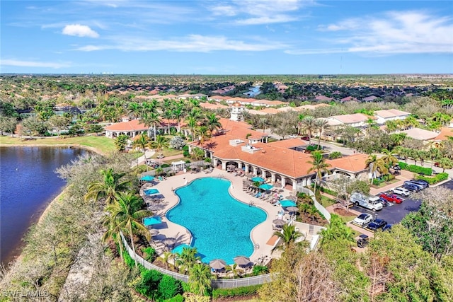 bird's eye view with a water view and a residential view