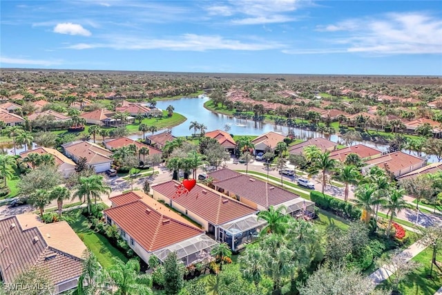 bird's eye view featuring a water view and a residential view