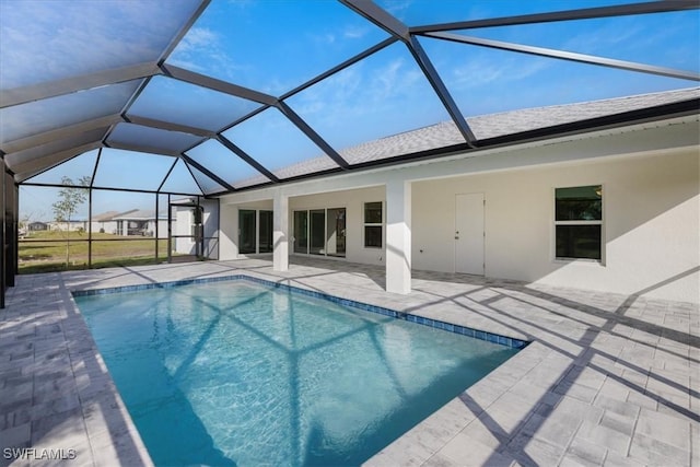 view of pool featuring a lanai and a patio