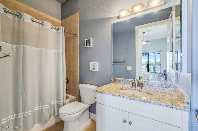 full bathroom featuring vanity, shower / bath combination with curtain, ceiling fan, and toilet