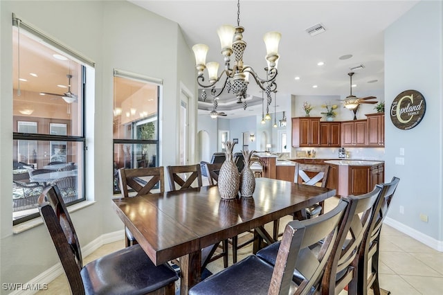 dining space featuring light tile patterned flooring and ceiling fan