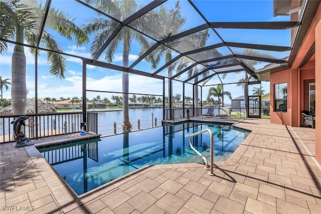 view of swimming pool featuring a water view, a lanai, and a patio