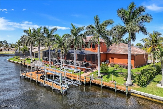 dock area featuring a water view and glass enclosure