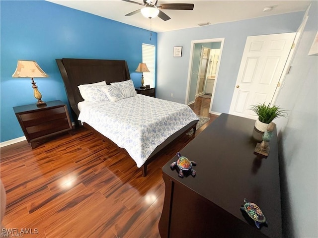 bedroom featuring dark wood-type flooring and ceiling fan