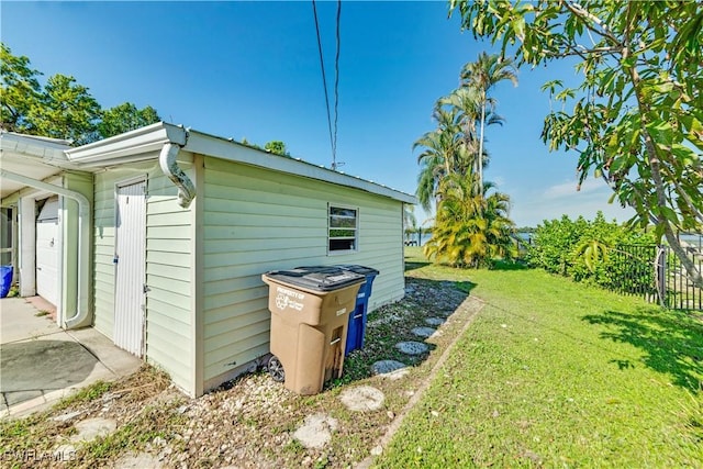 view of side of property featuring a yard