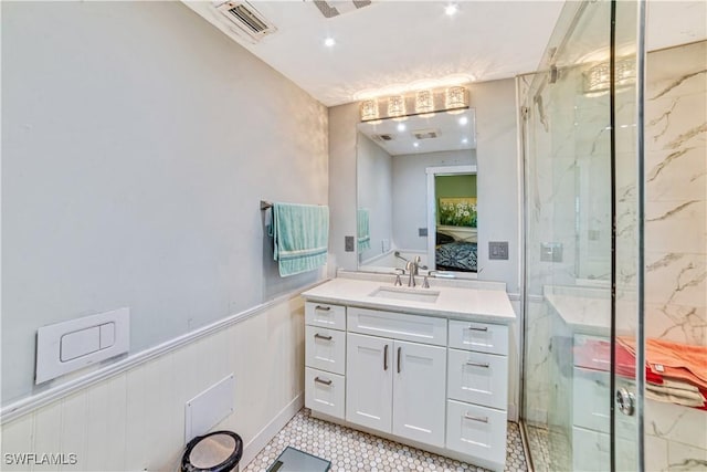 bathroom with walk in shower and vanity