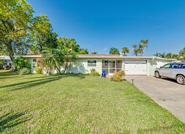 ranch-style house with a garage and a front lawn