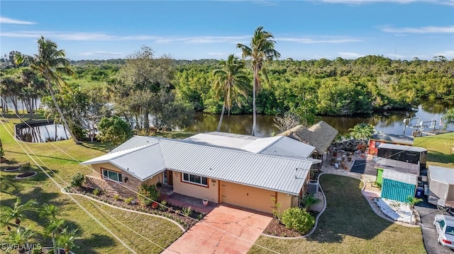 birds eye view of property featuring a water view