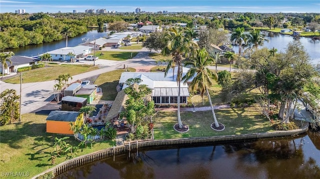 birds eye view of property featuring a water view