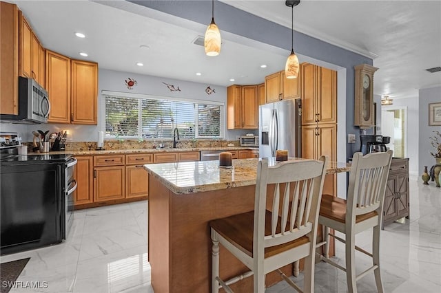 kitchen featuring crown molding, appliances with stainless steel finishes, a kitchen breakfast bar, light stone countertops, and decorative light fixtures