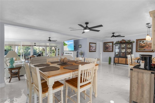 dining room featuring crown molding