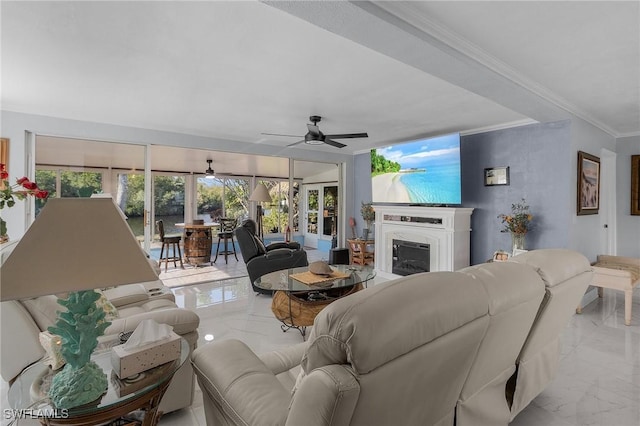 living room featuring ornamental molding and ceiling fan