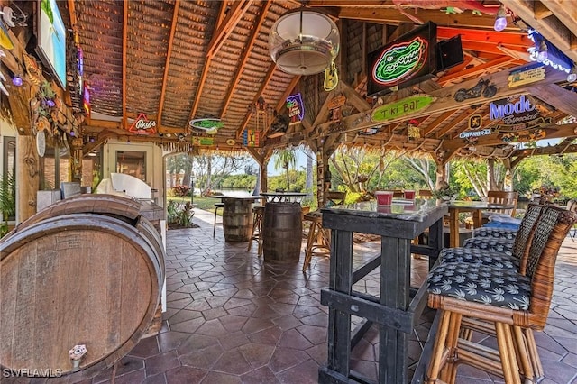 view of patio with a gazebo and an outdoor bar