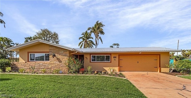 ranch-style house featuring a garage and a front yard