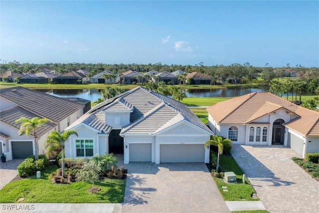 bird's eye view featuring a residential view and a water view