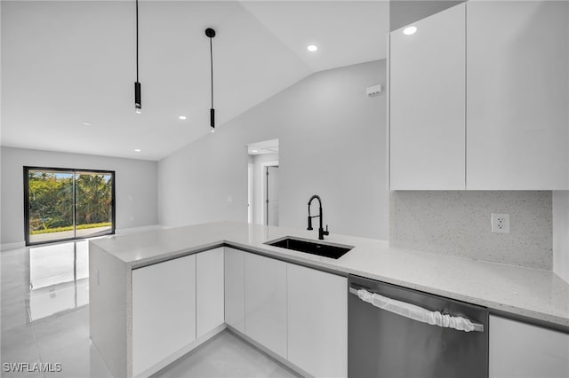 kitchen featuring white cabinetry, sink, stainless steel dishwasher, and decorative light fixtures