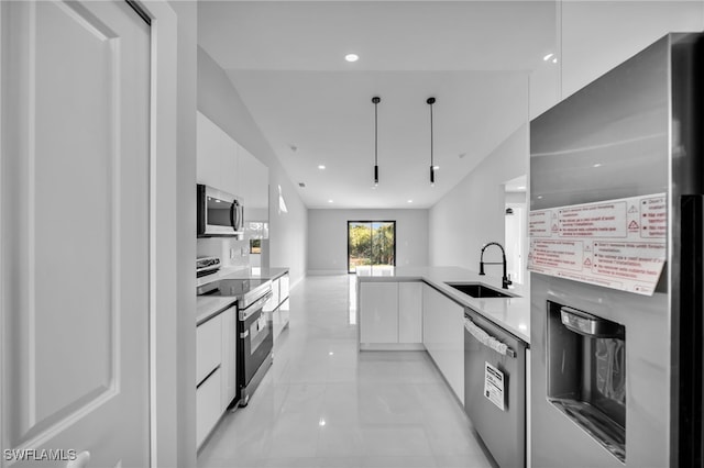 kitchen with white cabinetry, appliances with stainless steel finishes, and sink