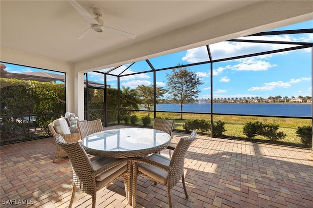 1606 Santiago Cir, Naples, FL 34113 - sunroom / solarium featuring outdoor dining space, a ceiling fan, and a water view