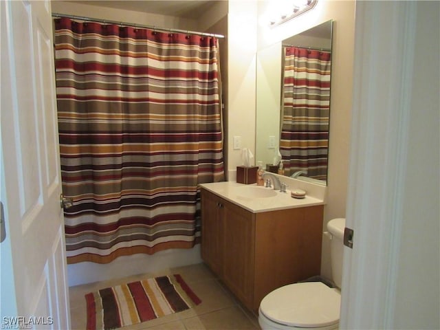 bathroom featuring shower / tub combo with curtain, tile patterned floors, and vanity