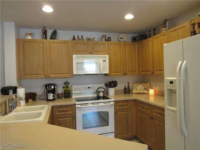 kitchen with sink and white appliances