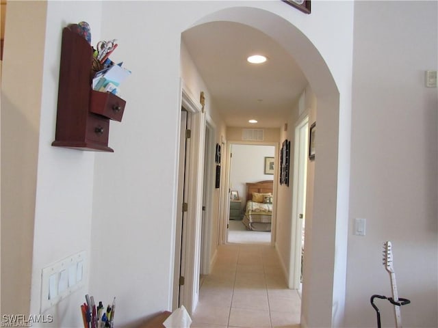 corridor with light tile patterned flooring