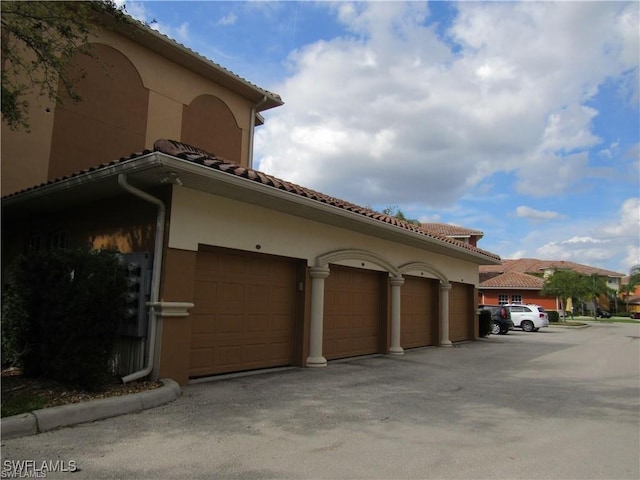 view of side of home with a garage