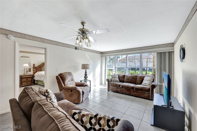 tiled living room featuring crown molding and ceiling fan