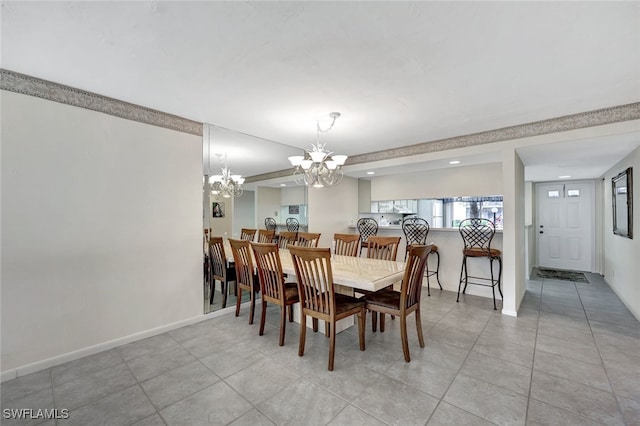 tiled dining space with a notable chandelier