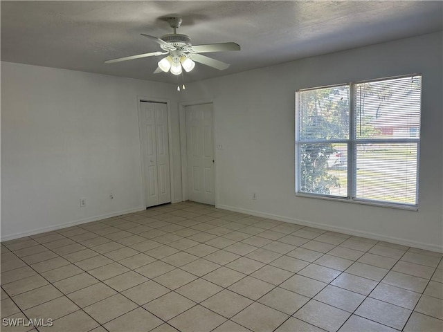 empty room featuring ceiling fan