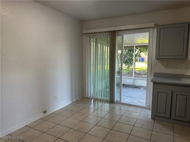 entryway with light tile patterned floors