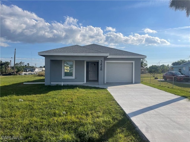 view of front of property featuring stucco siding, an attached garage, concrete driveway, and a front lawn