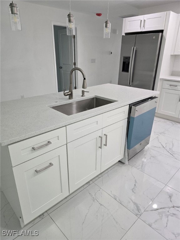 kitchen with marble finish floor, stainless steel refrigerator with ice dispenser, a sink, white cabinets, and dishwasher