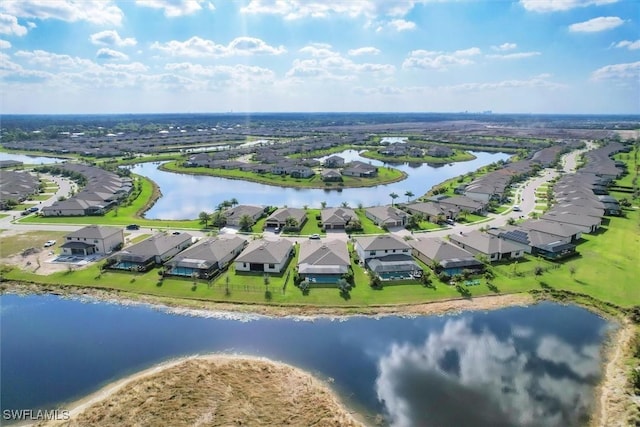 drone / aerial view with a water view