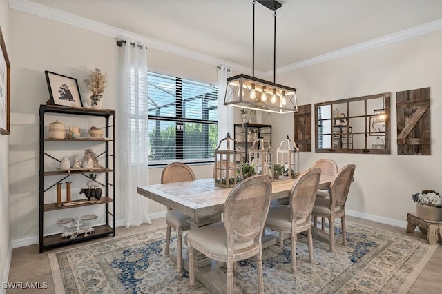 dining area with light tile patterned flooring and ornamental molding