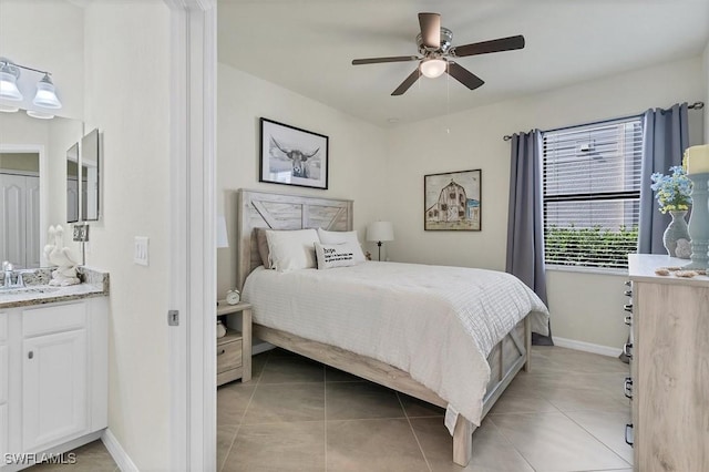 bedroom with sink, ceiling fan, and light tile patterned flooring