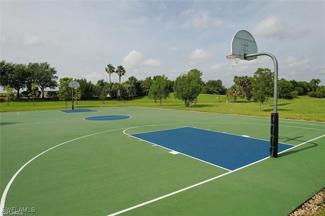 view of basketball court featuring a lawn