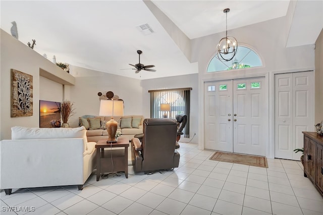 entryway with ceiling fan with notable chandelier, visible vents, and light tile patterned flooring