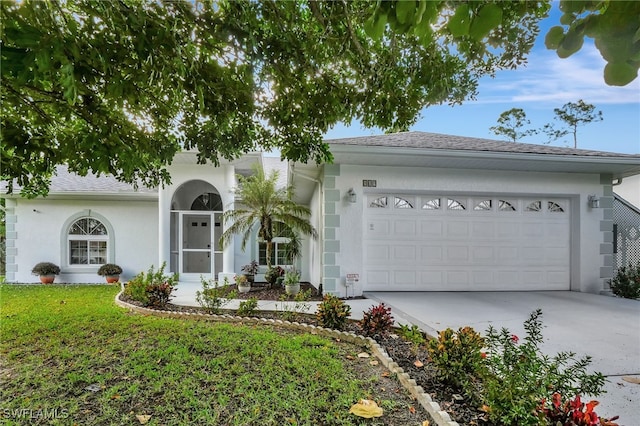 single story home with an attached garage, driveway, roof with shingles, stucco siding, and a front yard