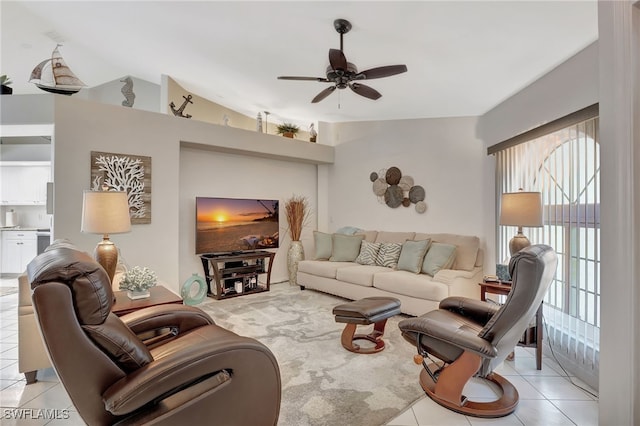 living room with vaulted ceiling, light tile patterned floors, and a ceiling fan