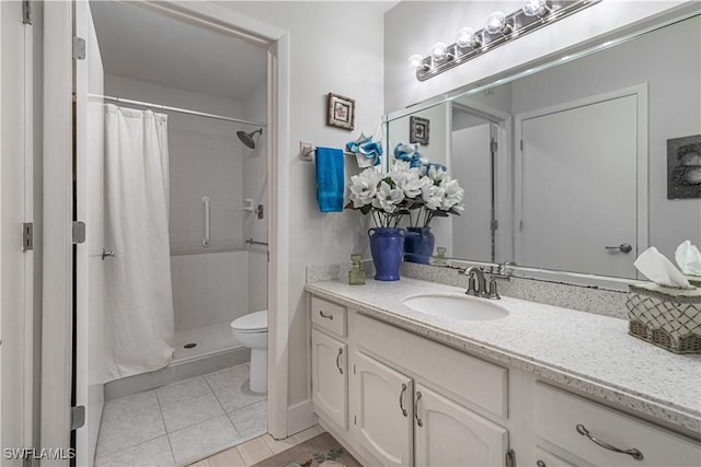 bathroom featuring vanity, tile patterned floors, toilet, and a shower with shower curtain