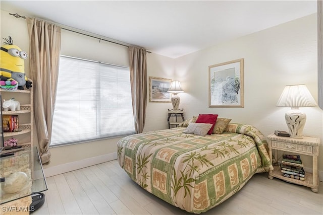 bedroom with light hardwood / wood-style floors