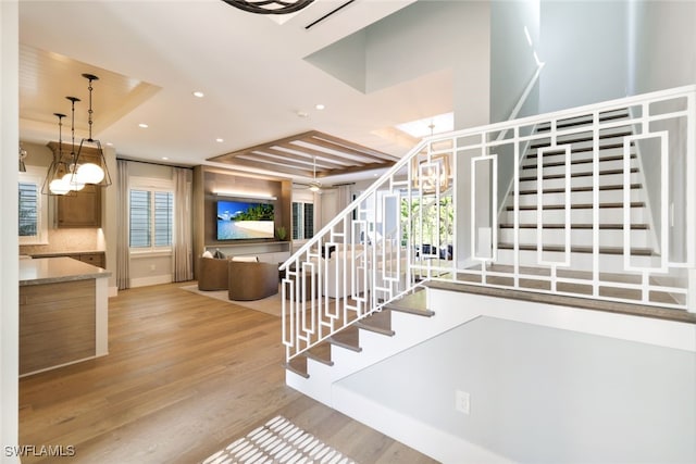 stairs with hardwood / wood-style flooring