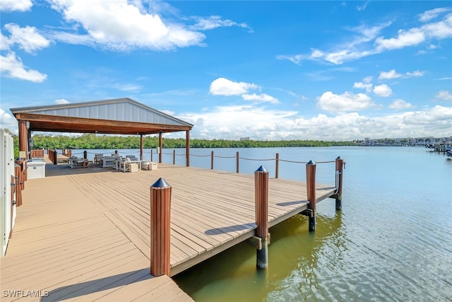 view of dock with a water view and a gazebo