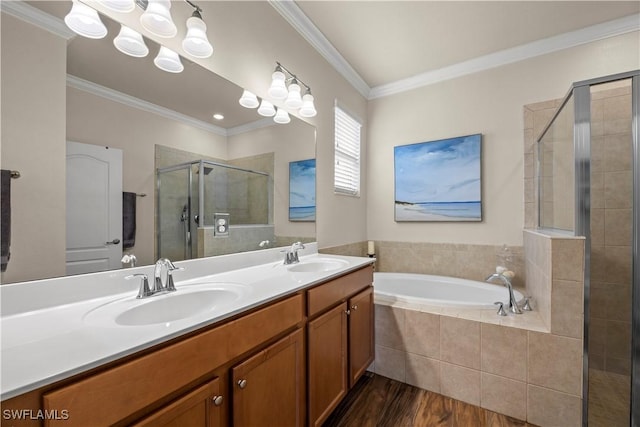 bathroom featuring hardwood / wood-style flooring, crown molding, separate shower and tub, and vanity