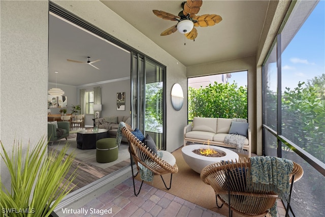 sunroom / solarium with ceiling fan