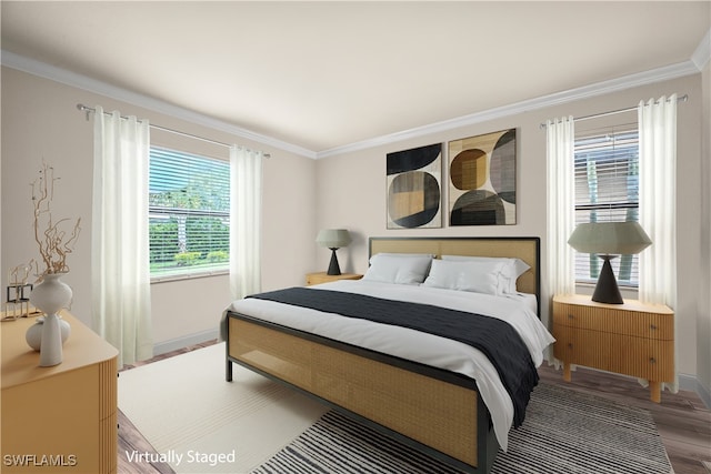 bedroom with crown molding and hardwood / wood-style flooring